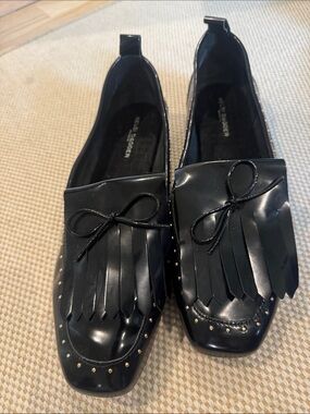 Kelsi Dagger Women’s Patent Leather Black Fringe Bow Loafers with Studded Design